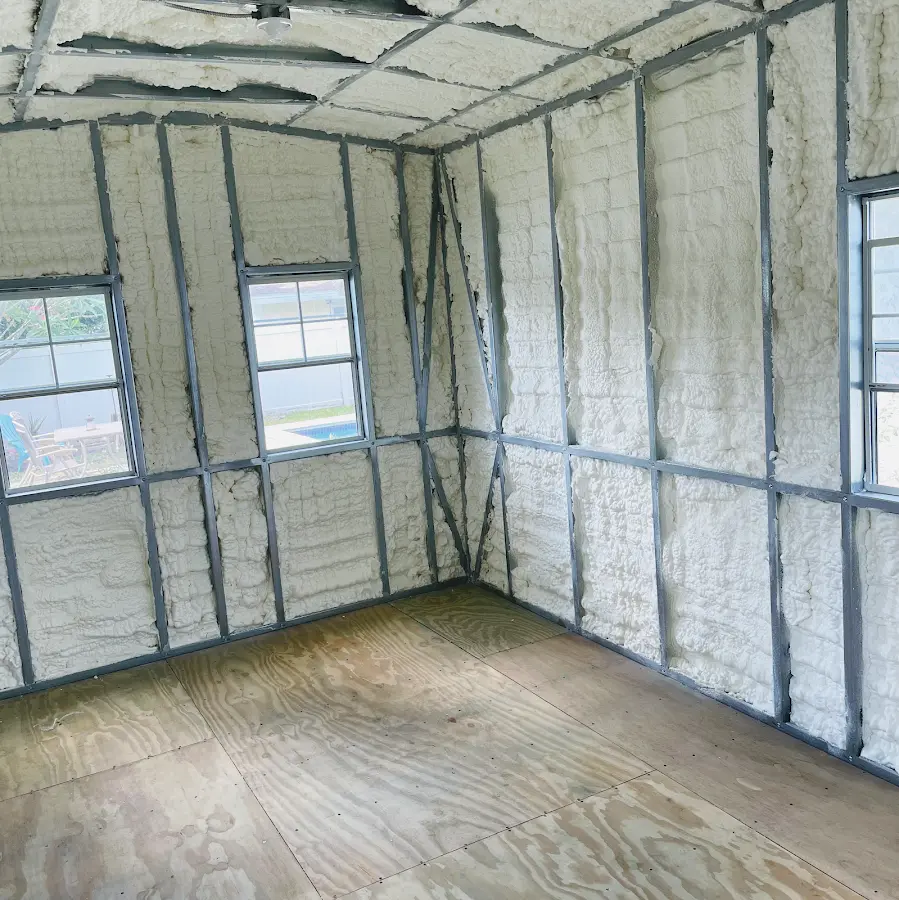 Closed-cell spray foam insulation applied to wall cavities in a residential project in Camillus